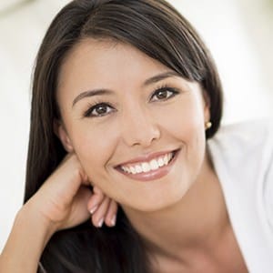 Young woman with gorgeous smile thanks to proper brushing and flossing