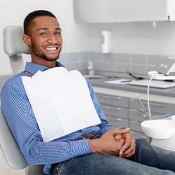 Happy patient sitting upright in dental treatment chair