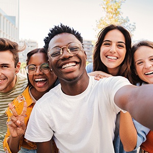 Group of friends smiling for selfie
