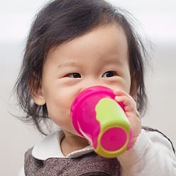 Child drinking from sippy cup
