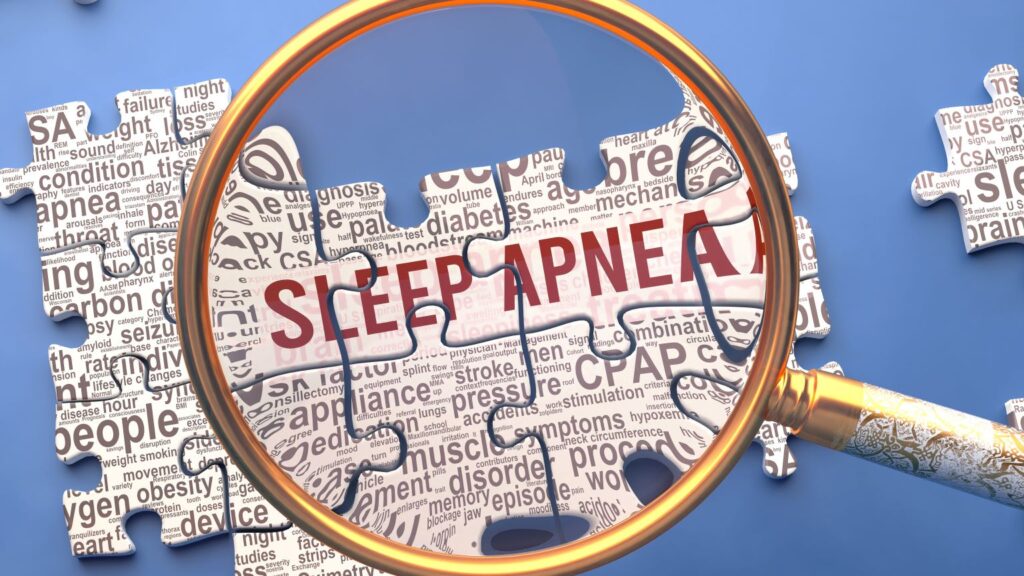A magnifying glass looking at puzzle pieces that contain words relating to sleep apnea.